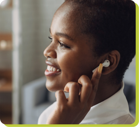 Smiling woman listening to podcast